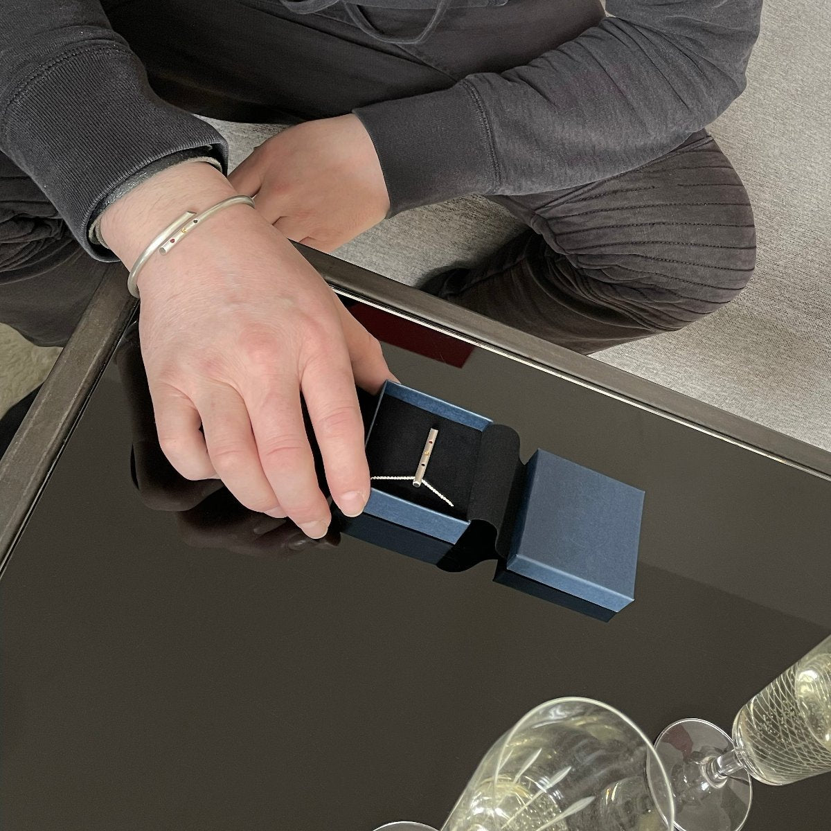 B1 necklace with amulet and bangle with precious stones