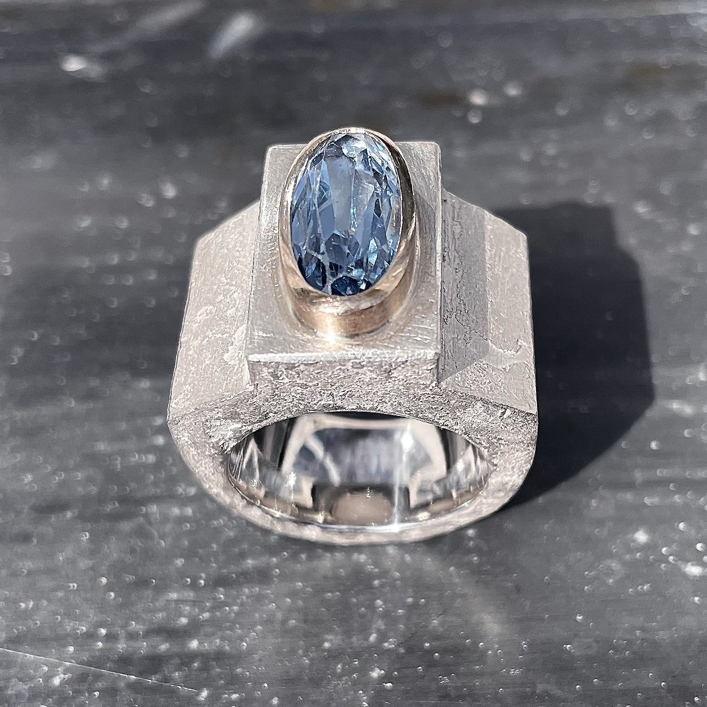 Silver ring with aquamarine in gold setting
