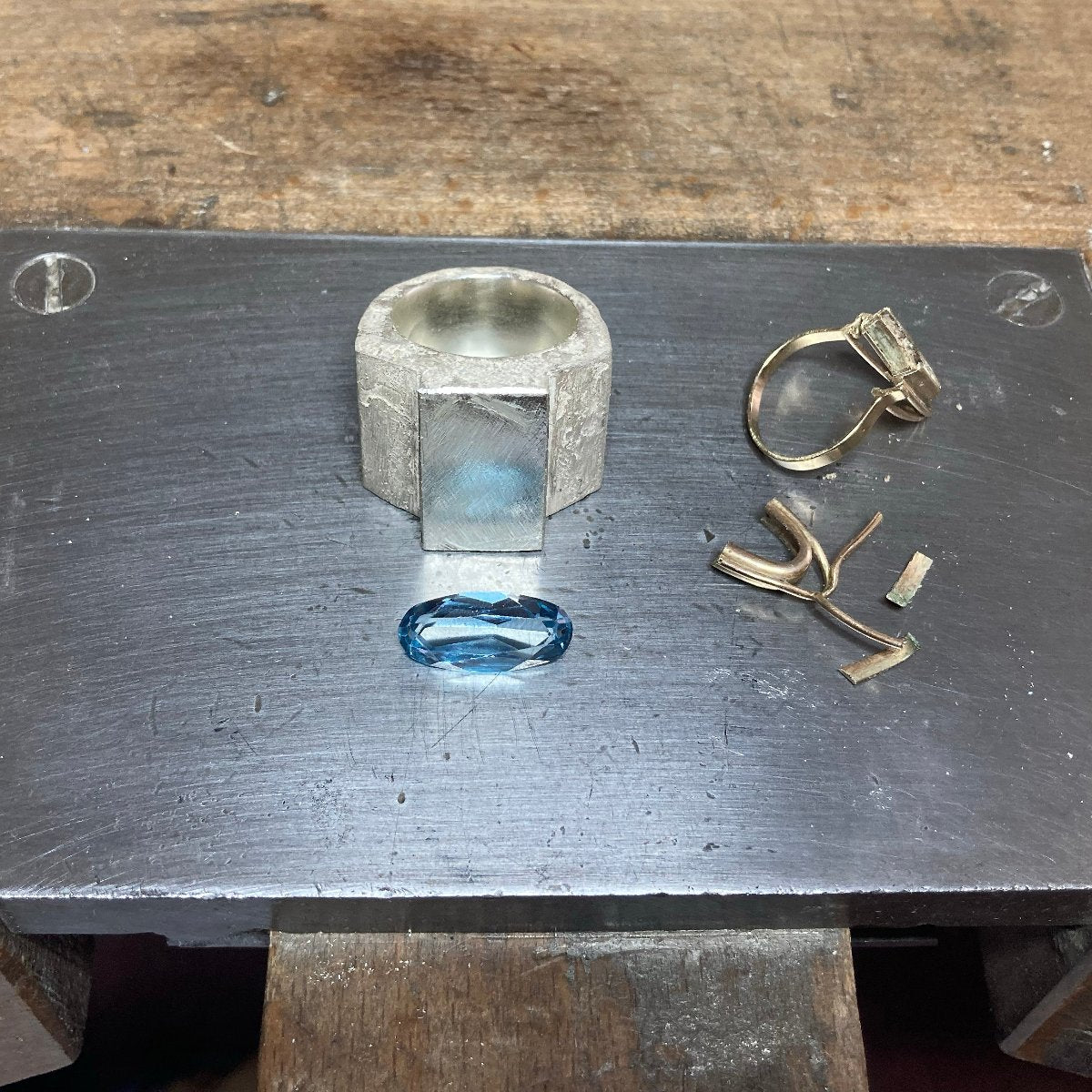 Silver ring with aquamarine in gold setting in progress
