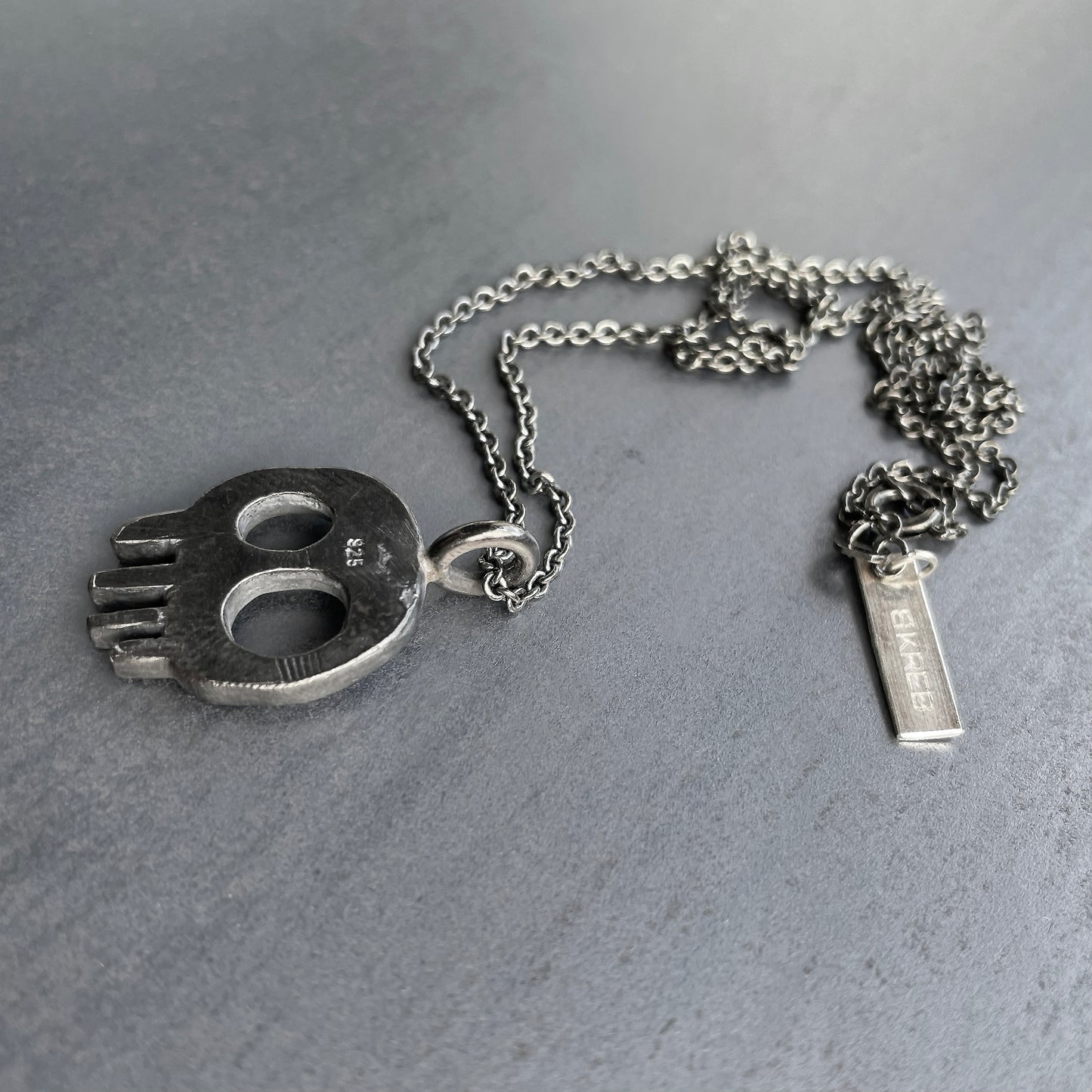Skull necklace blackened back side