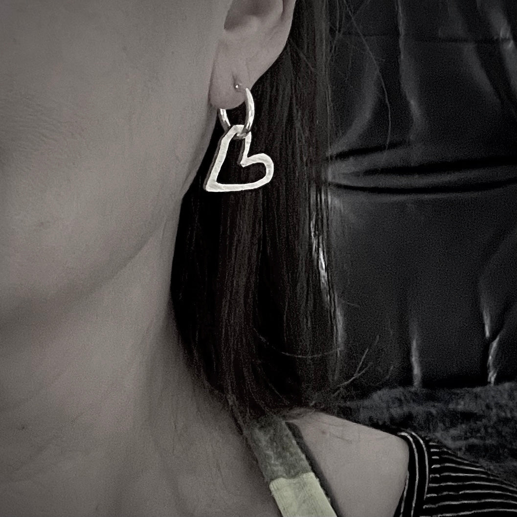 Heart hoops in sterling silver worn