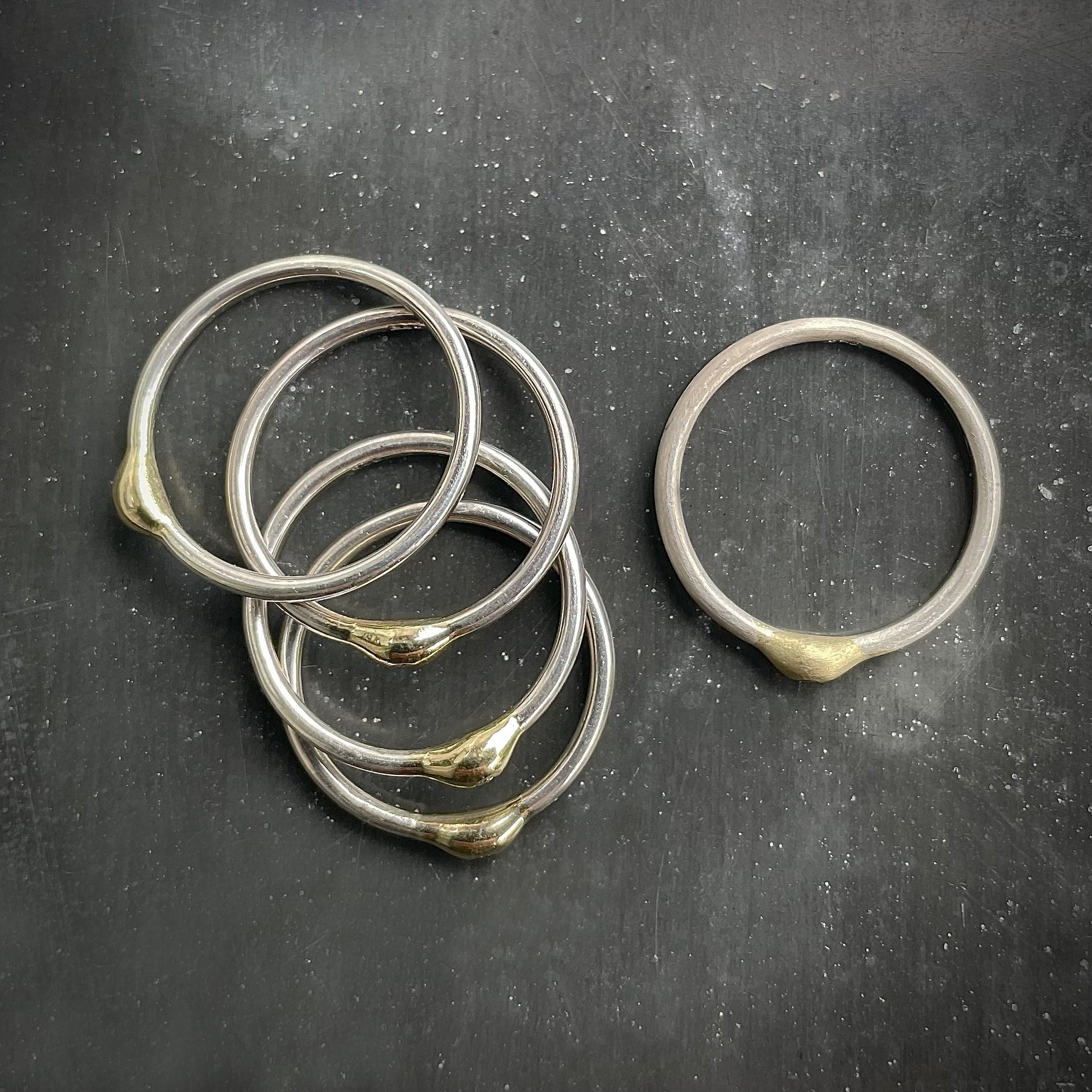 Set of silver rings with golden pearl and diamond