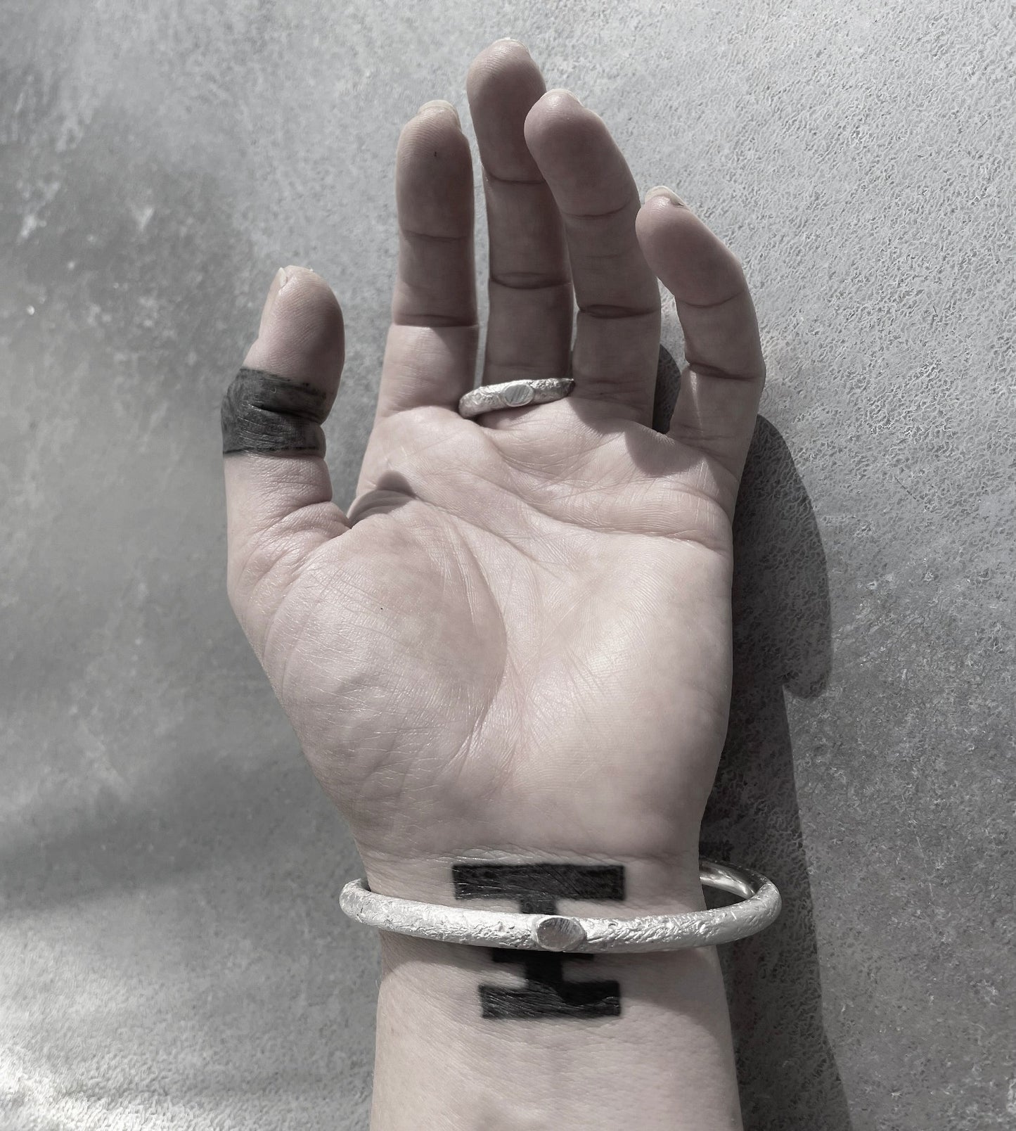 B1 bangle silver with surface structure back side wornI shop.bkreb.com