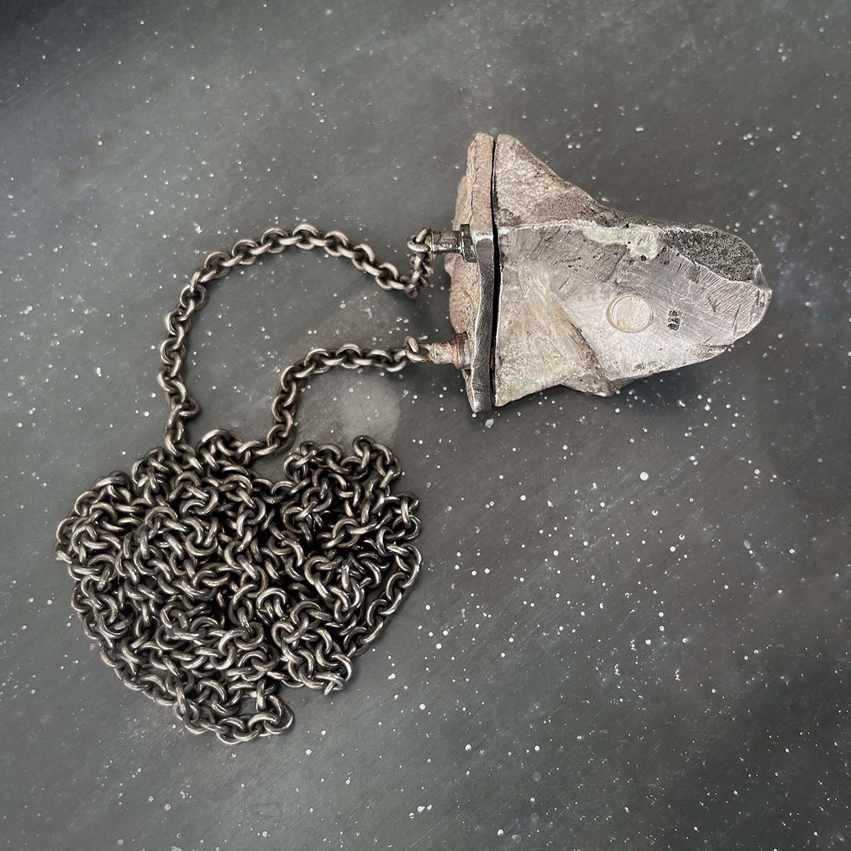 X.b amulet  back side with anchore chain
