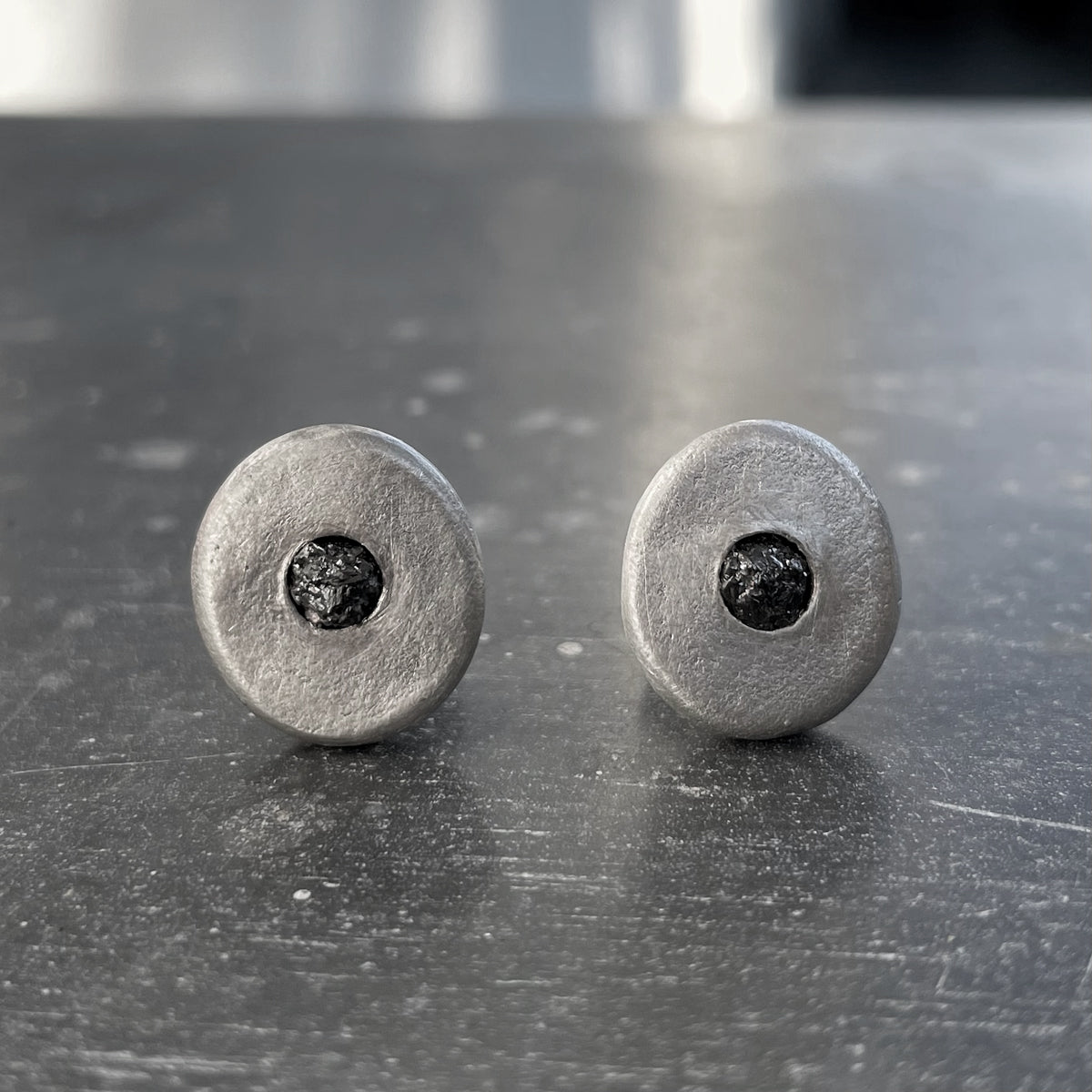 Pair of silver earrings with black gemstones 