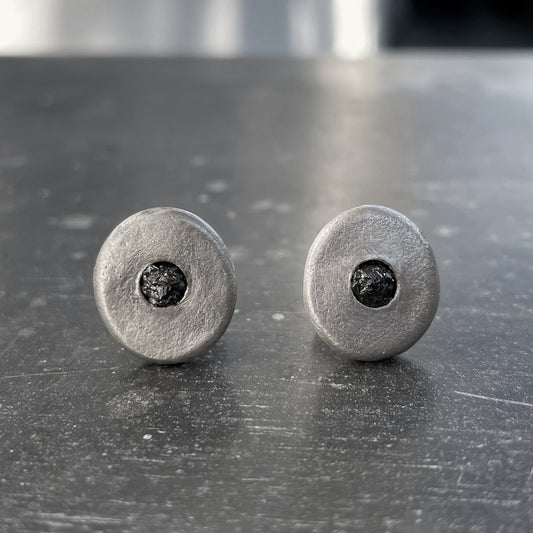 Pair of silver earrings with black gemstones 