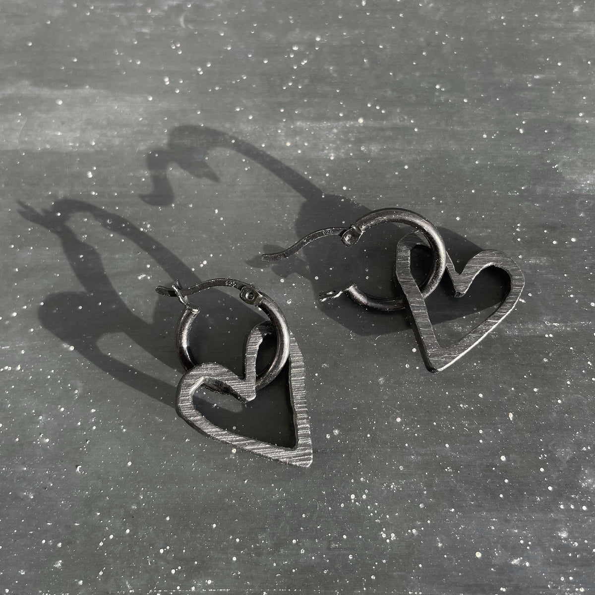 Black heart hoops in oxidised silver