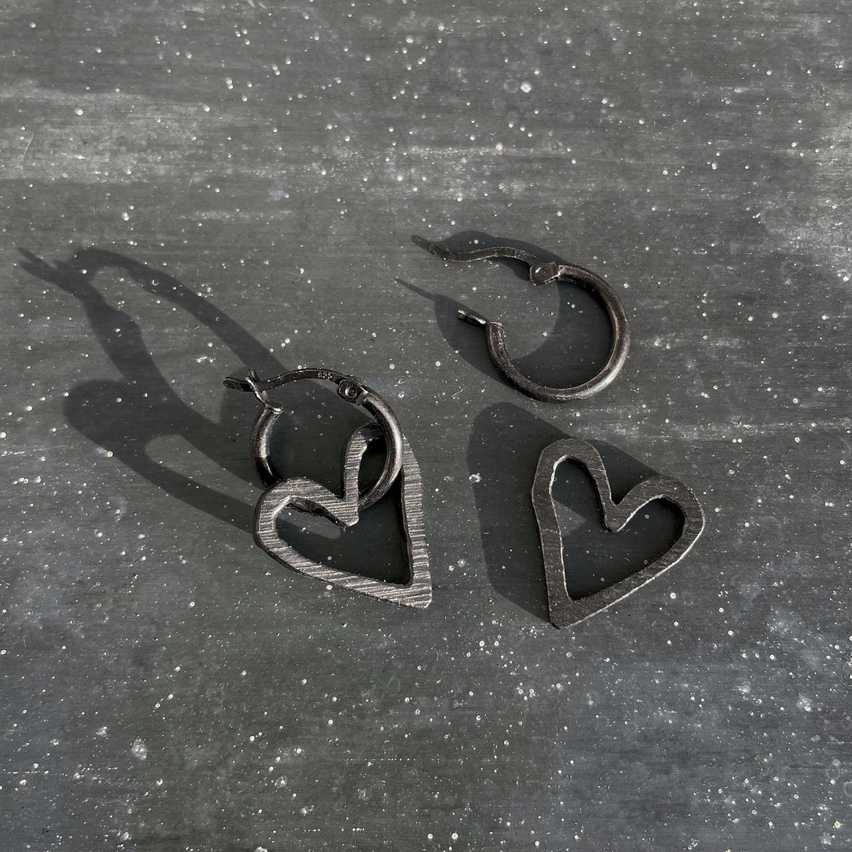 Black hearts with hoops in 925 silver