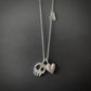 Silver necklace with two pendants skull and heart